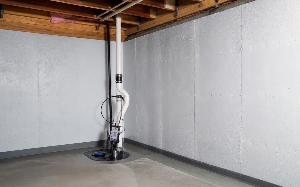 Waterproofed basement with a sump pump installed in the corner